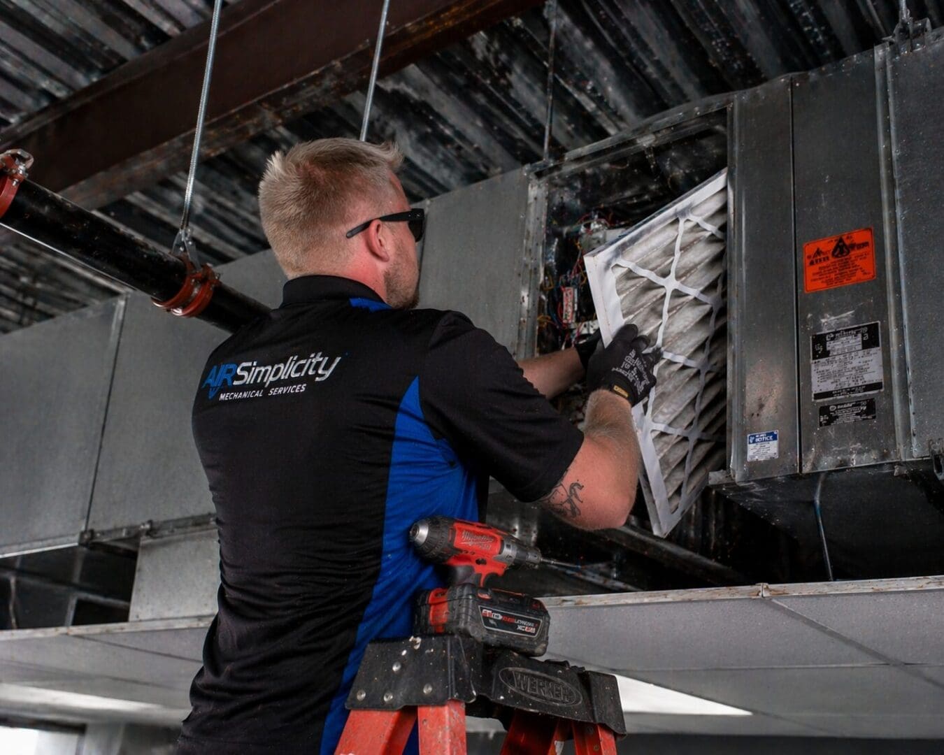 Tech working above ceiling 3